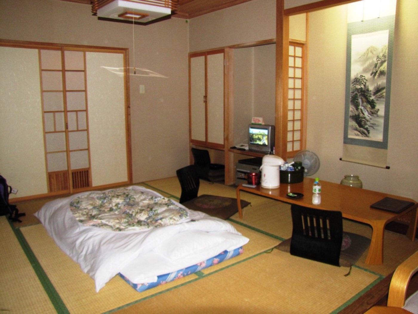 A tatami-matted ryokan room with a low table, Japan
